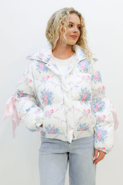 Women white blue pink floral puffer jacket for winter with cute pink bows in it