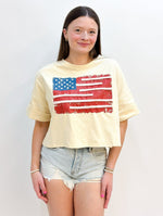 The iconic USA flag design adds a timeless and classic touch, while the cropped silhouette keeps you cool and comfortable on warm summer days.