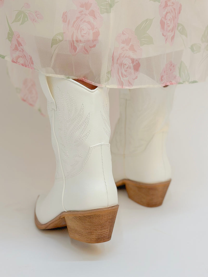 white embroidery detailed cowboy booties