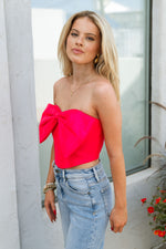 bright pink strapless top