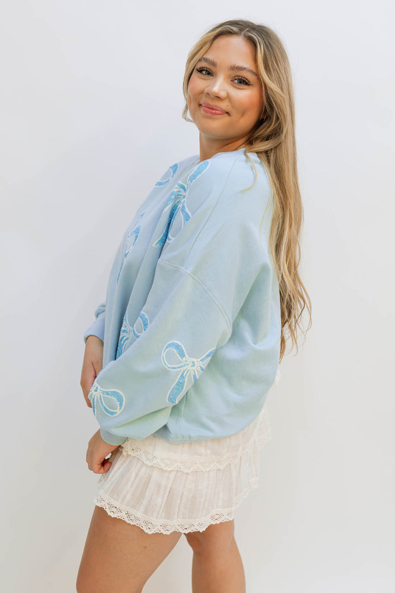 blue bow sweatshirt white skirt