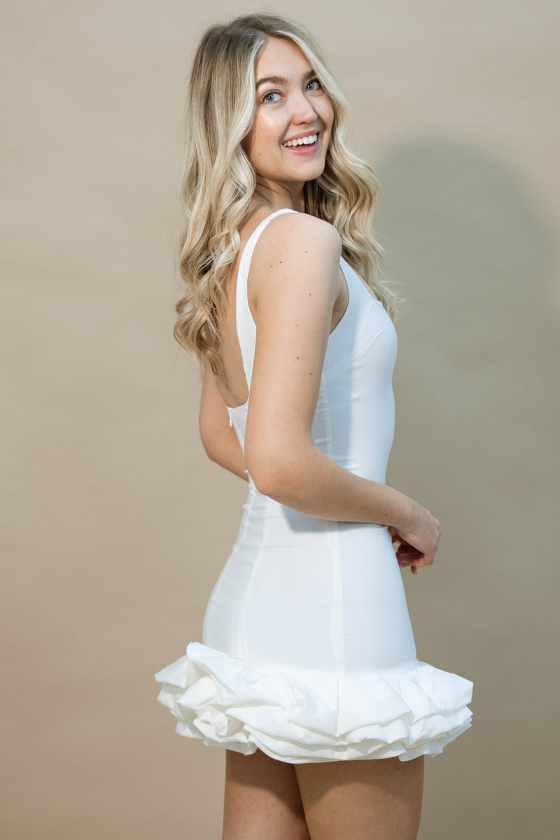 White minimalist party dress with statement hem