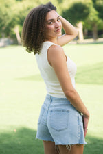 Ivory sleeveless button up top
