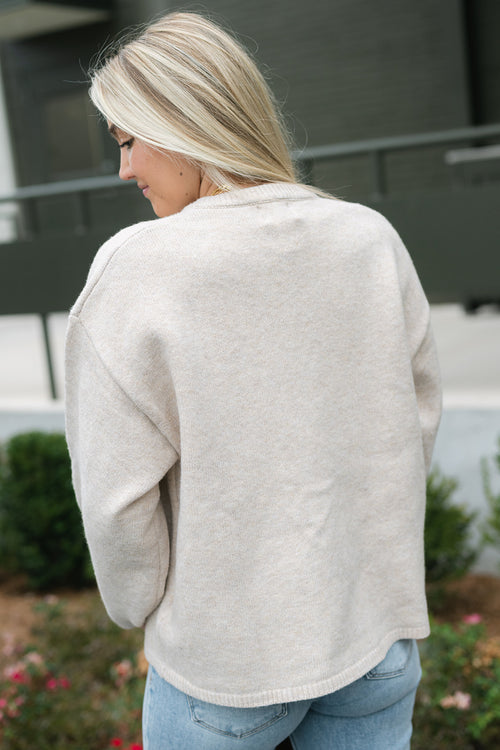 soft beige knit cardigan with buttons