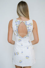 flirty white mini with floral detailing