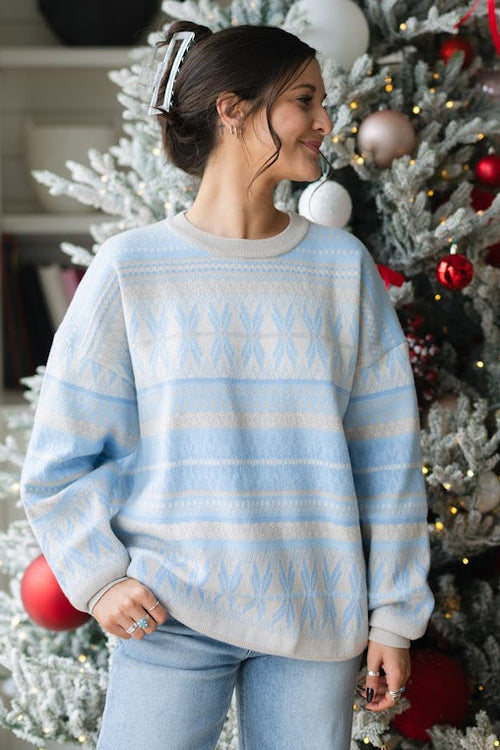 light blue ski inspired sweater with cream pattern