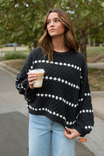 black knitted sweater with white polka dot