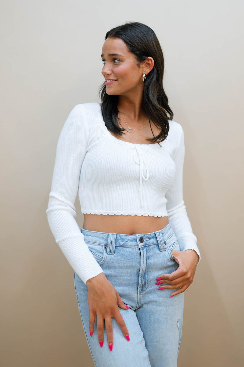 white long sleeve knit top