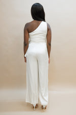 white party with one shoulder jumpsuit