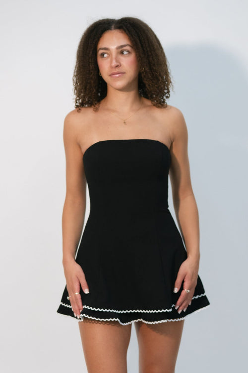 strapless black mini dress with white trim