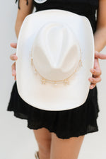 white cowboy hat with bow charms