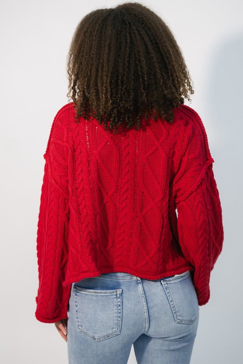 red oversized sweater with cable knit