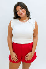 red and white game day outfit with white tank top and red shorts