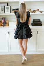 black dress with bow sleeves