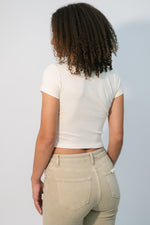 Vintage sports baby tee cream
