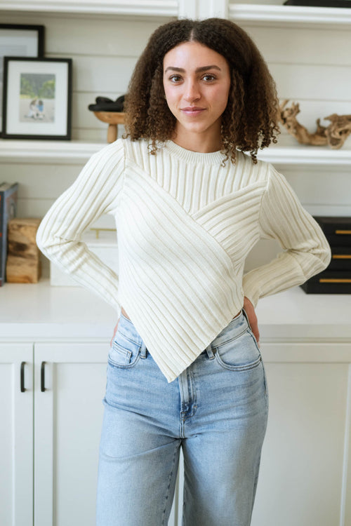 Ivory knit sweater with ribbed hem