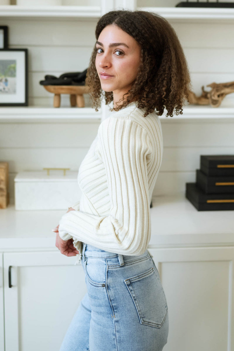 Neutral tone asymmetric sweater outfit