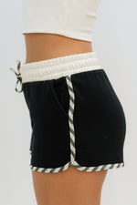 black shorts with contrast trim