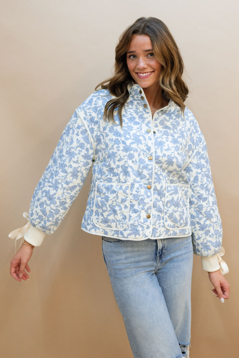 cute women blue floral quilted jacket with cuffed bow ribbon 