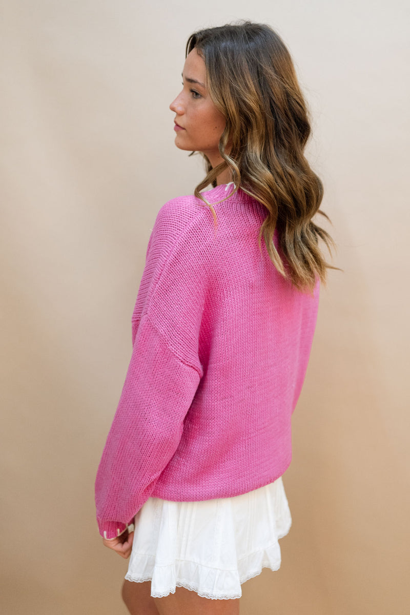 pink and white sweater outfit