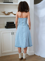 Strapless denim dress styled with cowboy boots