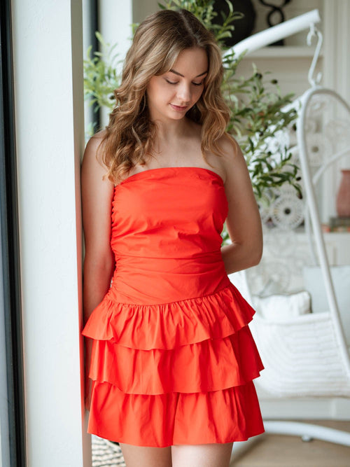 Coral strapless dress with ruffle skirt