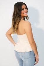 Off-white strapless suede peplum top