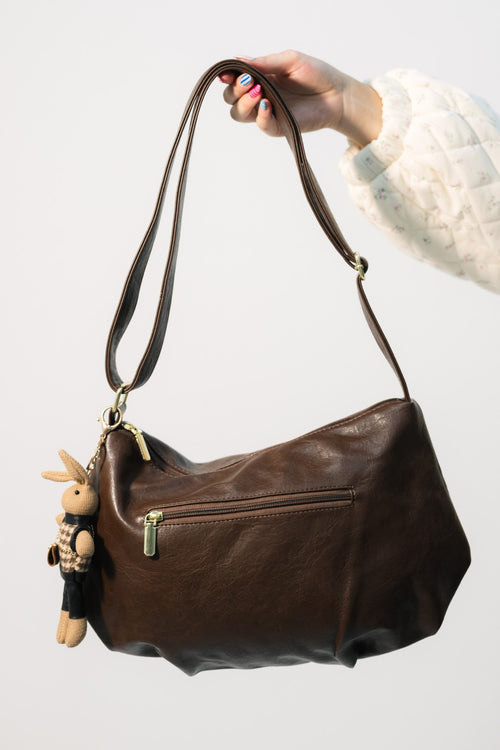 Chocolate brown leather crossbody bag with charms