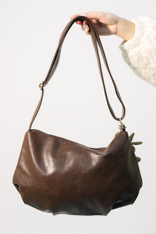 Slouchy brown leather bag for keychain styling