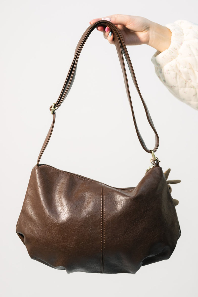 Slouchy brown leather bag for keychain styling