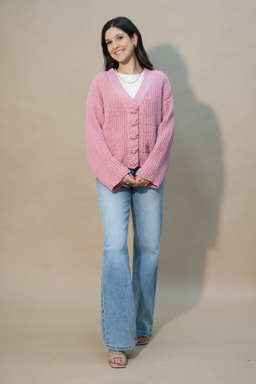 cozy pink knit sweater with flower buttons