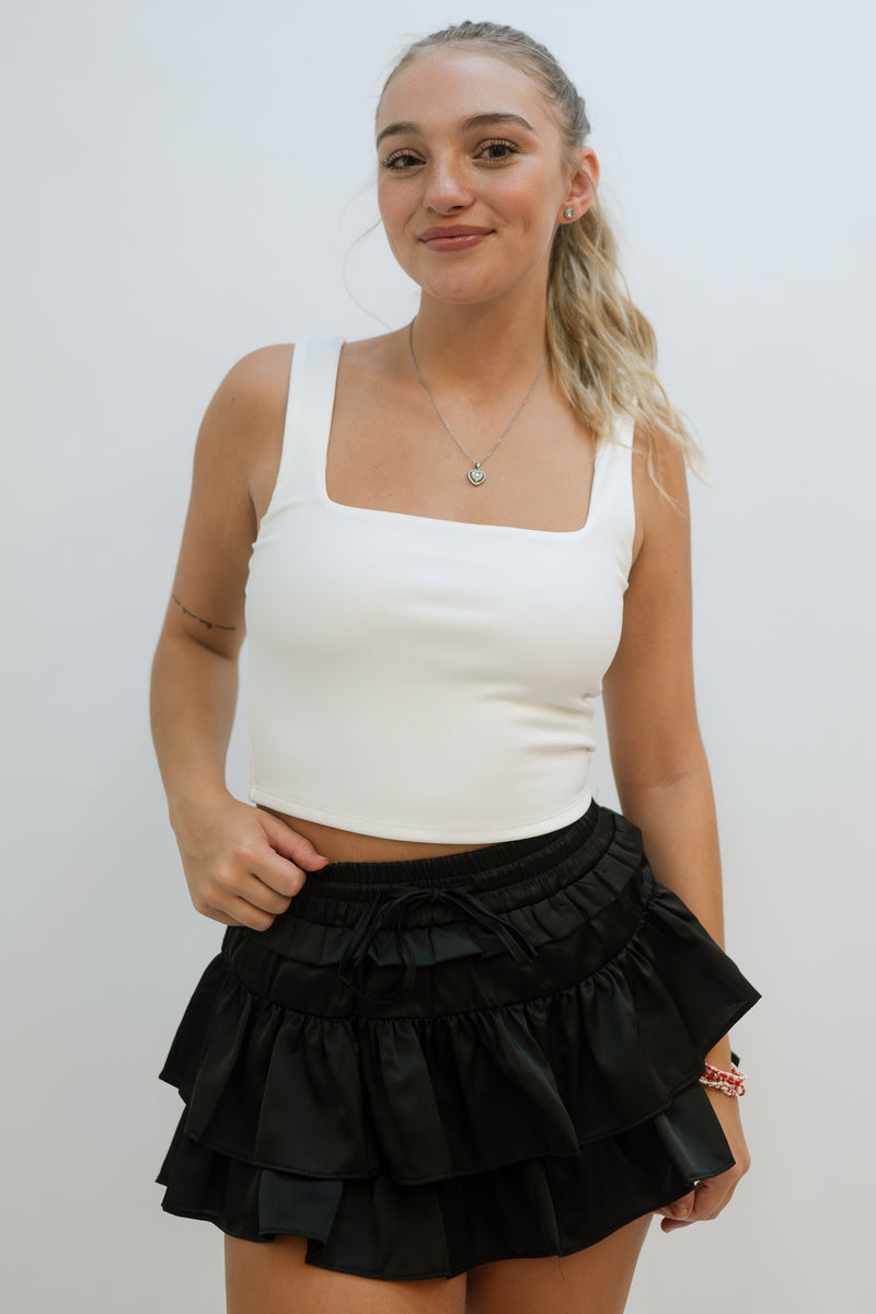 square neckline white cropped top  with black ruffle skort