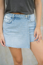 Light wash denim skort raw hem