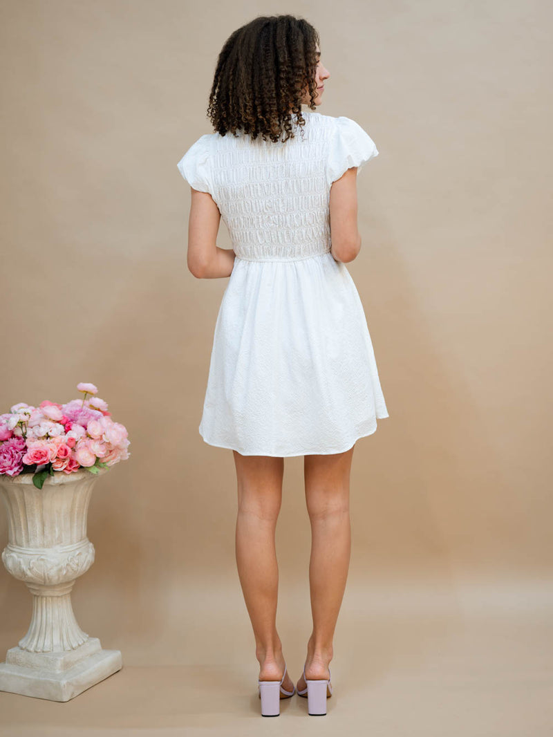 Smocked back white mini dress