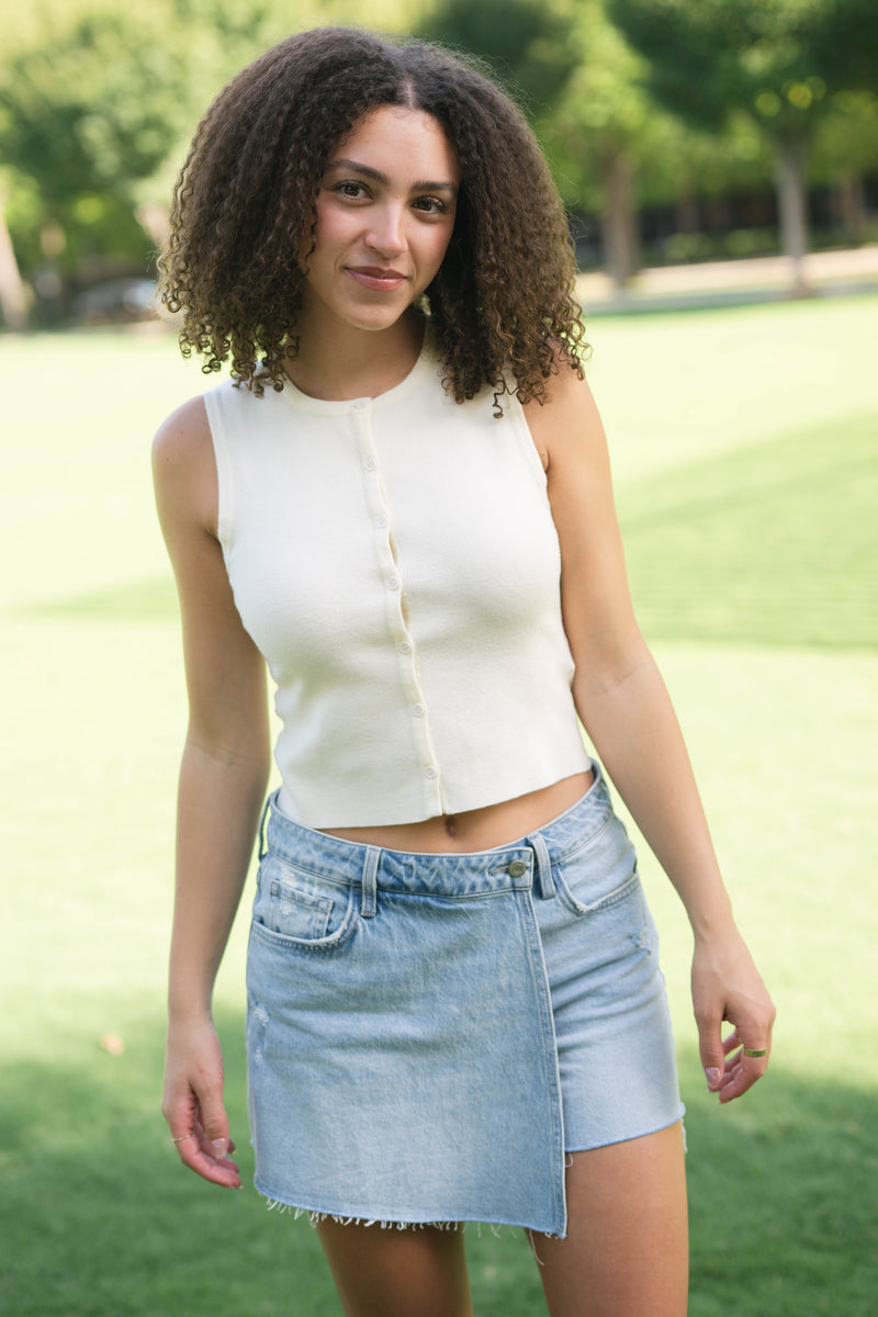 Minimalist cream sleeveless top