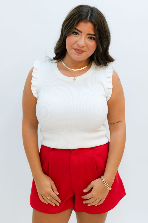 basic essential white ruffle sleeve tank top with red shorts 