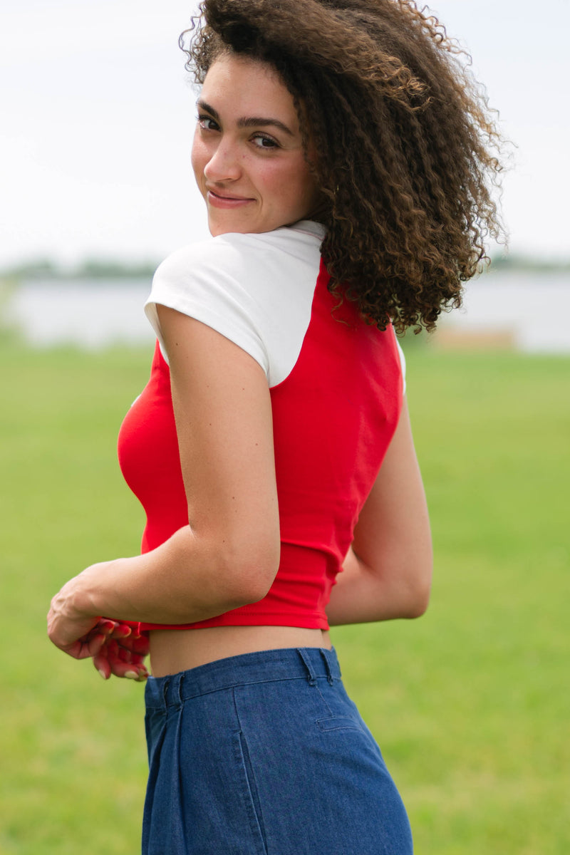 red and white sporty baby tee
