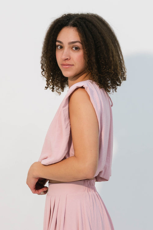 Blush pink sleeveless blouse with structured shoulders