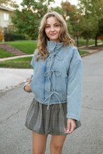 Quilted denim jacket with bows