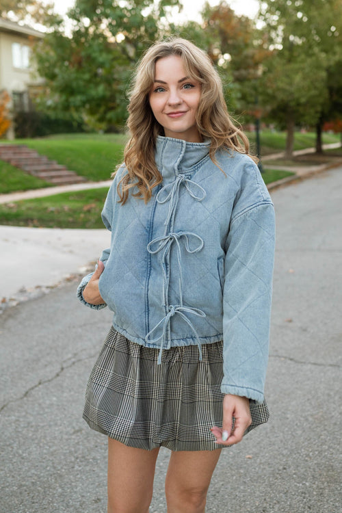 Quilted denim jacket with bows